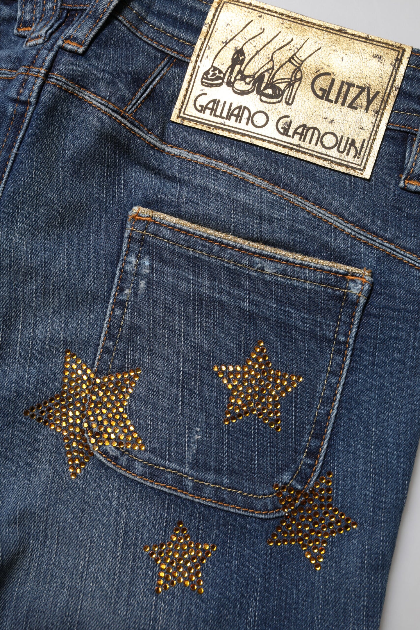 John Galliano Blaue Denim-Jeans mit weitem Bein aus Baumwolle mit mittlerer Taille