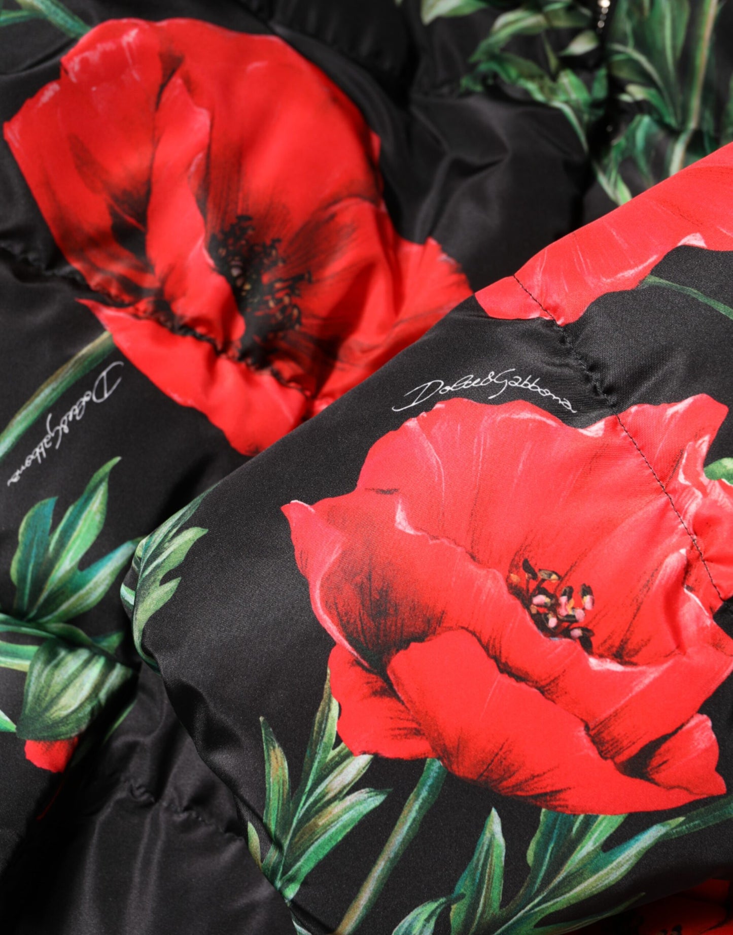 Dolce & Gabbana Schwarze Steppjacke aus geblümtem Polyester mit Kapuze