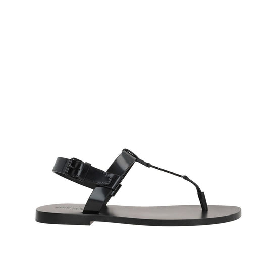 Saint Laurent Flache Sandalen aus schwarzem Kalbsleder