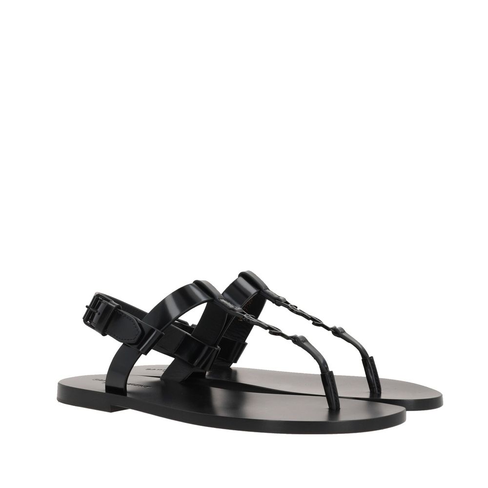 Saint Laurent Flache Sandalen aus schwarzem Kalbsleder