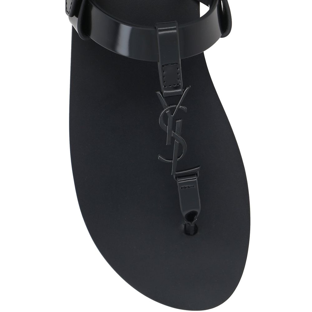 Saint Laurent Flache Sandalen aus schwarzem Kalbsleder